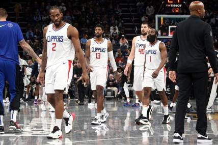 Feb 23, 2024; Memphis, Tennessee, USA; Los Angeles Clippers forward Kawhi Leonard (2), forward Paul George (13), center Ivica Zubac (40) and guard James Harden (1) walk to the bench during a time out during the second half against the Memphis Grizzlies at FedExForum. Mandatory Credit: Petre Thomas-USA TODAY Sports