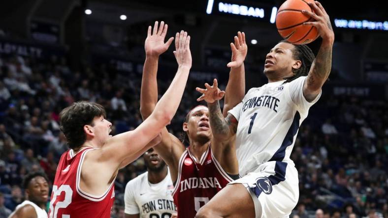 Feb 24, 2024; University Park, Pennsylvania, USA; Penn State Nittany Lions guard Ace Baldwin Jr (1) drives to the basket as Indiana Hoosiers guard Trey Galloway (32) defends during the first half at Bryce Jordan Center. Mandatory Credit: Matthew O'Haren-USA TODAY Sports