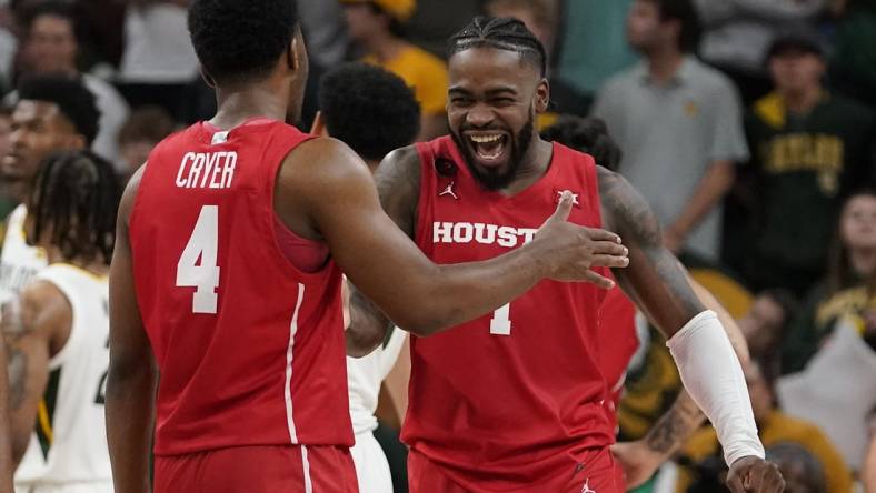 Feb 24, 2024; Waco, Texas, USA; Houston Cougars guard L.J. Cryer (4) and guard Jamal Shead (1) react in the closing moments of overtime against the Baylor Bears at Paul and Alejandra Foster Pavilion. Mandatory Credit: Raymond Carlin III-USA TODAY Sports