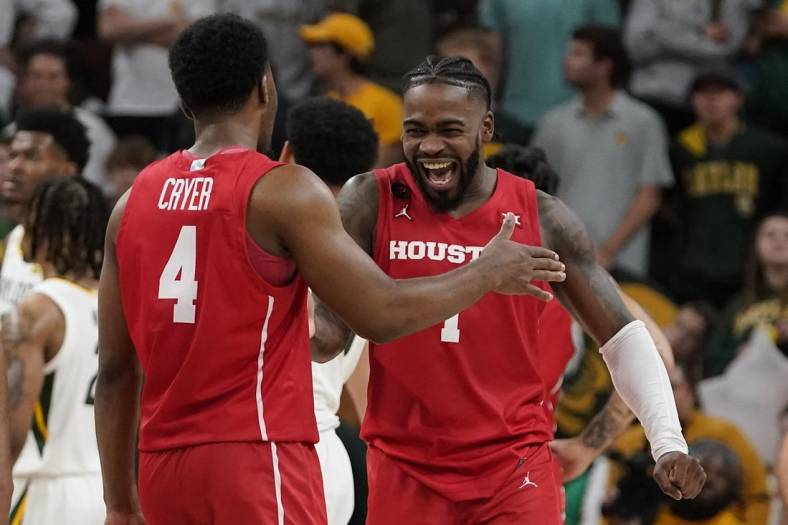 Feb 24, 2024; Waco, Texas, USA; Houston Cougars guard L.J. Cryer (4) and guard Jamal Shead (1) react in the closing moments of overtime against the Baylor Bears at Paul and Alejandra Foster Pavilion. Mandatory Credit: Raymond Carlin III-USA TODAY Sports