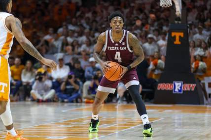 Feb 24, 2024; Knoxville, Tennessee, USA; Texas A&M Aggies guard Wade Taylor IV (4) looks to pass the ball against the Tennessee Volunteers during the first half at Thompson-Boling Arena at Food City Center. Mandatory Credit: Randy Sartin-USA TODAY Sports