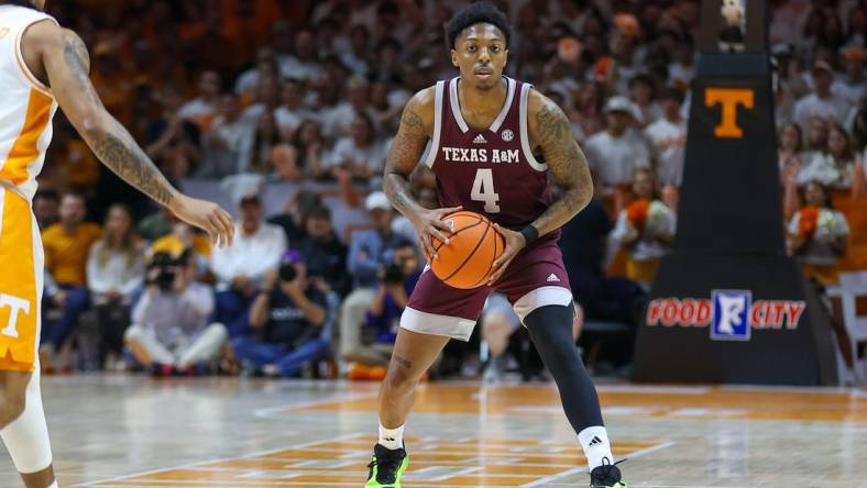 Feb 24, 2024; Knoxville, Tennessee, USA; Texas A&M Aggies guard Wade Taylor IV (4) looks to pass the ball against the Tennessee Volunteers during the first half at Thompson-Boling Arena at Food City Center. Mandatory Credit: Randy Sartin-USA TODAY Sports