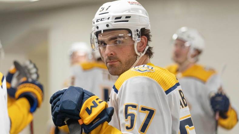 Feb 24, 2024; San Jose, California, USA; Nashville Predators defenseman Dante Fabbro (57) before the start of the first period against the San Jose Sharks at SAP Center at San Jose. Mandatory Credit: Stan Szeto-USA TODAY Sports