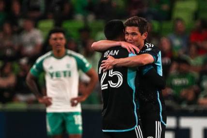 Minnesota United FC midfielders Alejandro Bran (25) and Wil Trapp (20) celebrate as time expires in the match against Austin FC at Q2 stadium on Feb. 24, 2024 in Austin. Minnesota defeated Austin 2-1.