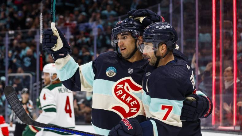 Feb 24, 2024; Seattle, Washington, USA; Seattle Kraken right wing Jordan Eberle (7) celebrates with center Matty Beniers (10) after scoring a goal against the Minnesota Wild during the third period at Climate Pledge Arena. Mandatory Credit: Joe Nicholson-USA TODAY Sports