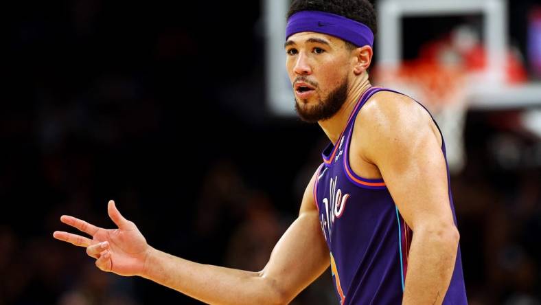 Feb 25, 2024; Phoenix, Arizona, USA; Phoenix Suns guard Devin Booker (1) reacts after a play during the first quarter of the game against the Los Angeles Lakers at Footprint Center. Mandatory Credit: Mark J. Rebilas-USA TODAY Sports