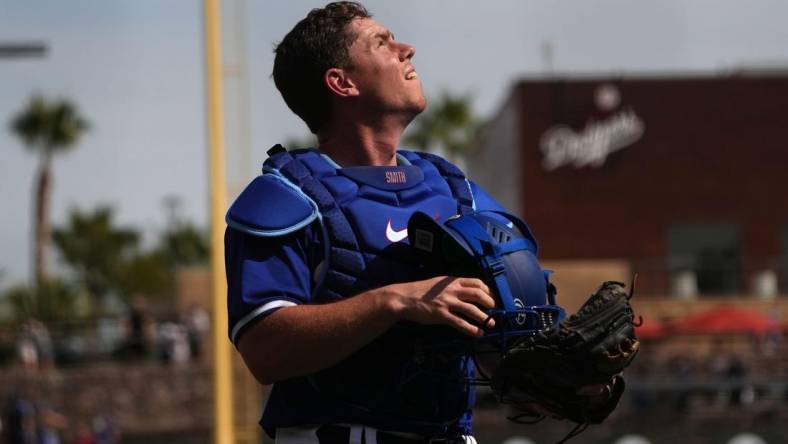 Feb 25, 2024; Phoenix, Arizona, USA; Los Angeles Dodgers catcher Will Smith (16) looks on against the Oakland Athletics during the second inning at Camelback Ranch-Glendale. Mandatory Credit: Joe Camporeale-USA TODAY Sports