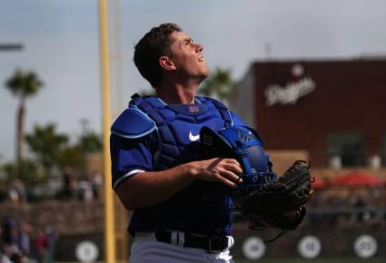 Feb 25, 2024; Phoenix, Arizona, USA; Los Angeles Dodgers catcher Will Smith (16) looks on against the Oakland Athletics during the second inning at Camelback Ranch-Glendale. Mandatory Credit: Joe Camporeale-USA TODAY Sports