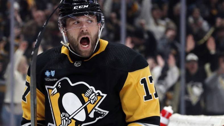 Feb 25, 2024; Pittsburgh, Pennsylvania, USA;  Pittsburgh Penguins right wing Bryan Rust (17) reacts after scoring his second goal of the game against the Philadelphia Flyers during the second period at PPG Paints Arena. Mandatory Credit: Charles LeClaire-USA TODAY Sports