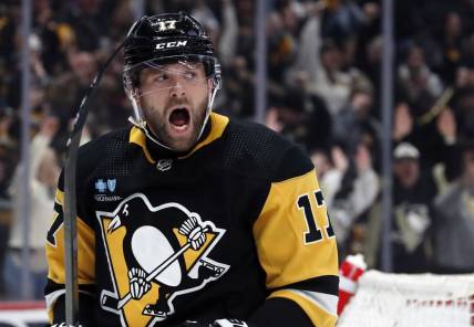 Feb 25, 2024; Pittsburgh, Pennsylvania, USA;  Pittsburgh Penguins right wing Bryan Rust (17) reacts after scoring his second goal of the game against the Philadelphia Flyers during the second period at PPG Paints Arena. Mandatory Credit: Charles LeClaire-USA TODAY Sports