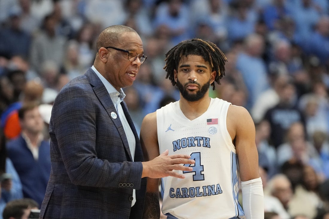 Feb 26, 2024; Chapel Hill, North Carolina, USA; North Carolina Tar Heels coach Hubert Davis with guard RJ Davis (4) in the second half at Dean E. Smith Center. Mandatory Credit: Bob Donnan-USA TODAY Sports