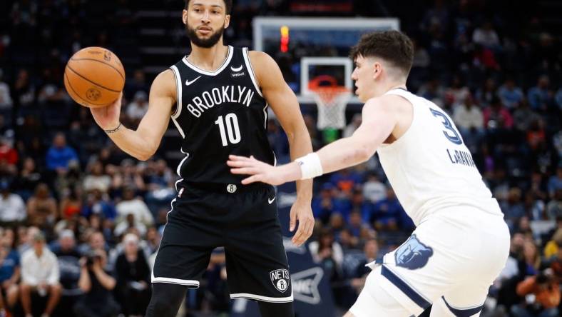 Feb 26, 2024; Memphis, Tennessee, USA; Brooklyn Nets guard Ben Simmons (10) passes the ball as Memphis Grizzlies forward Jake LaRavia (3) defends during the second half at FedExForum. Mandatory Credit: Petre Thomas-USA TODAY Sports