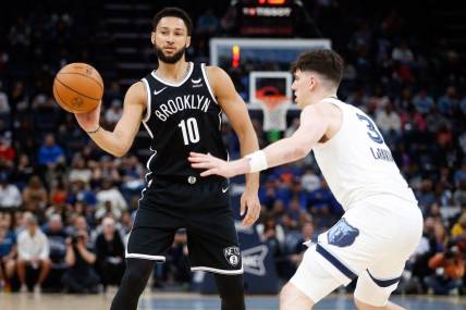Feb 26, 2024; Memphis, Tennessee, USA; Brooklyn Nets guard Ben Simmons (10) passes the ball as Memphis Grizzlies forward Jake LaRavia (3) defends during the second half at FedExForum. Mandatory Credit: Petre Thomas-USA TODAY Sports