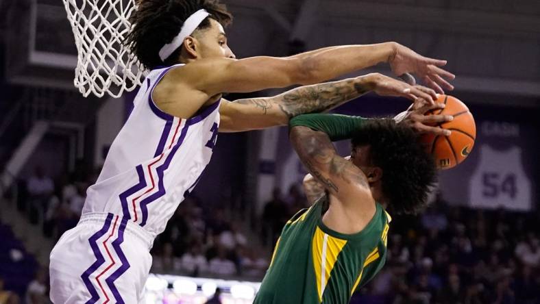 Feb 26, 2024; Fort Worth, Texas, USA; TCU Horned Frogs guard Micah Peavy (0) defends Baylor Bears forward Jalen Bridges (11) during the second half at Ed and Rae Schollmaier Arena. Mandatory Credit: Raymond Carlin III-USA TODAY Sports