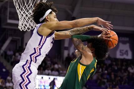 Feb 26, 2024; Fort Worth, Texas, USA; TCU Horned Frogs guard Micah Peavy (0) defends Baylor Bears forward Jalen Bridges (11) during the second half at Ed and Rae Schollmaier Arena. Mandatory Credit: Raymond Carlin III-USA TODAY Sports