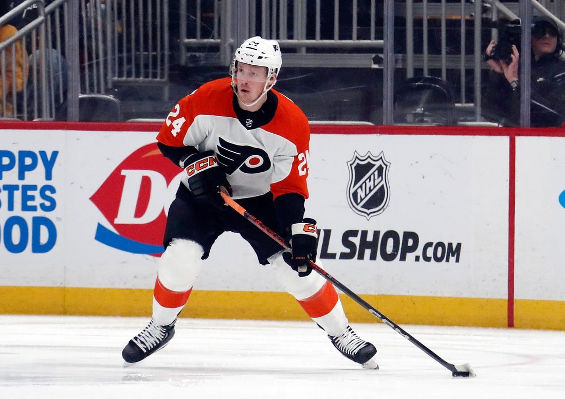 Feb 25, 2024; Pittsburgh, Pennsylvania, USA;  Philadelphia Flyers defenseman Nick Seeler (24) handles the puck against the Pittsburgh Penguins during the first period at PPG Paints Arena. Mandatory Credit: Charles LeClaire-USA TODAY Sports