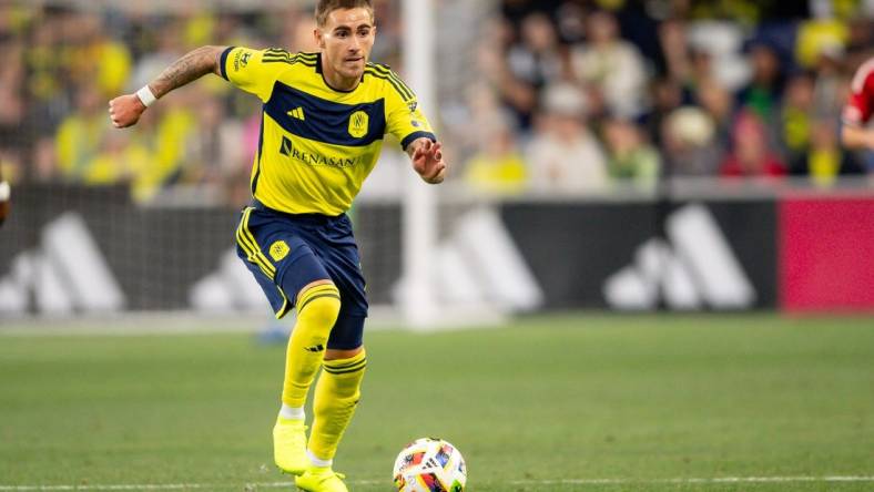 Feb 25, 2024; Nashville, Tennessee, USA;  Nashville SC forward Tyler Boyd (11) dribbles the ball against the New York Red Bulls during the second half at Geodis Park. Mandatory Credit: Steve Roberts-USA TODAY Sports