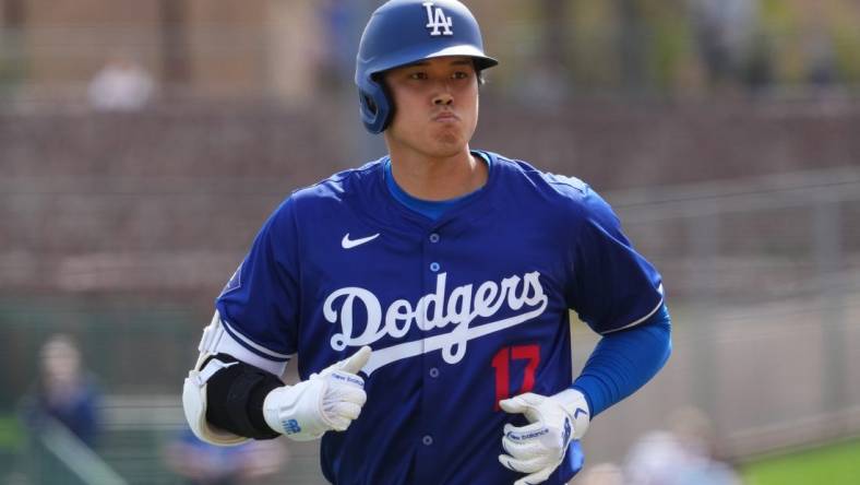 Feb 27, 2024; Phoenix, Arizona, USA; Los Angeles Dodgers designated hitter Shohei Ohtani (17) returns to the dugout after grounding into a double play during the third inning against the Chicago White Sox at Camelback Ranch-Glendale. Mandatory Credit: Joe Camporeale-USA TODAY Sports