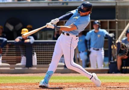 Feb 27, 2024; Port Charlotte, Florida, USA;  Tampa Bay Rays right fielder Josh Lowe (15) doubles during the second inning against the New York Yankees at Charlotte Sports Park. Mandatory Credit: Kim Klement Neitzel-USA TODAY Sports