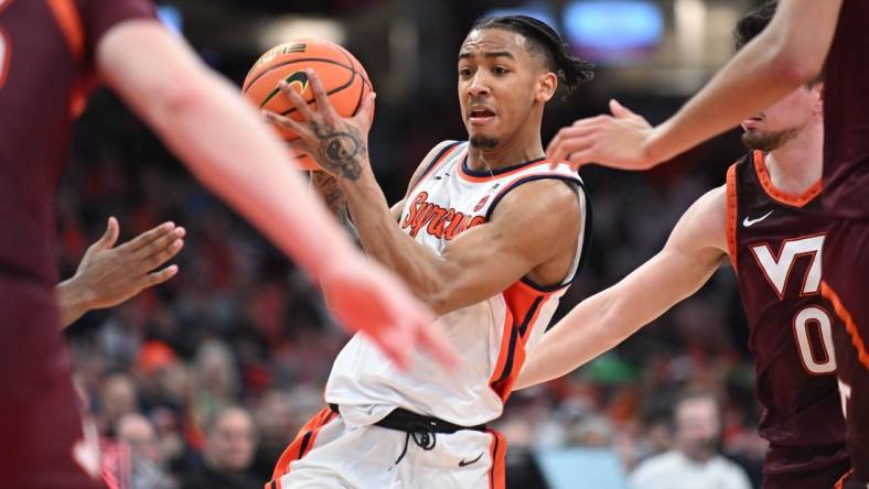 Feb 27, 2024; Syracuse, New York, USA; Syracuse Orange guard Judah Mintz handles the ball in traffic against the Virginia Tech Hokies in the second half at the JMA Wireless Dome. Mandatory Credit: Mark Konezny-USA TODAY Sports