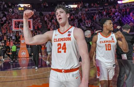 Feb 27, 2024; Clemson, South Carolina, USA; Clemson junior forward PJ Hall (24) and RJ Godfrey (10) celebrate after the Tigers beat Pitt 69-62 at Littlejohn Coliseum. Mandatory Credit: Ken Ruinard-USA TODAY Sports