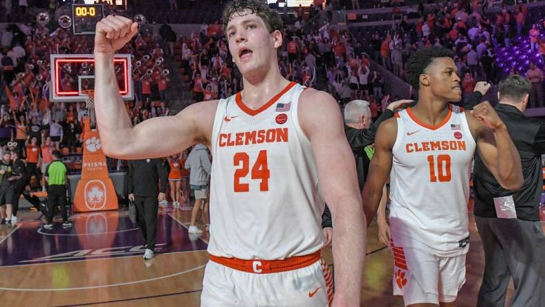 Feb 27, 2024; Clemson, South Carolina, USA; Clemson junior forward PJ Hall (24) and RJ Godfrey (10) celebrate after the Tigers beat Pitt 69-62 at Littlejohn Coliseum. Mandatory Credit: Ken Ruinard-USA TODAY Sports