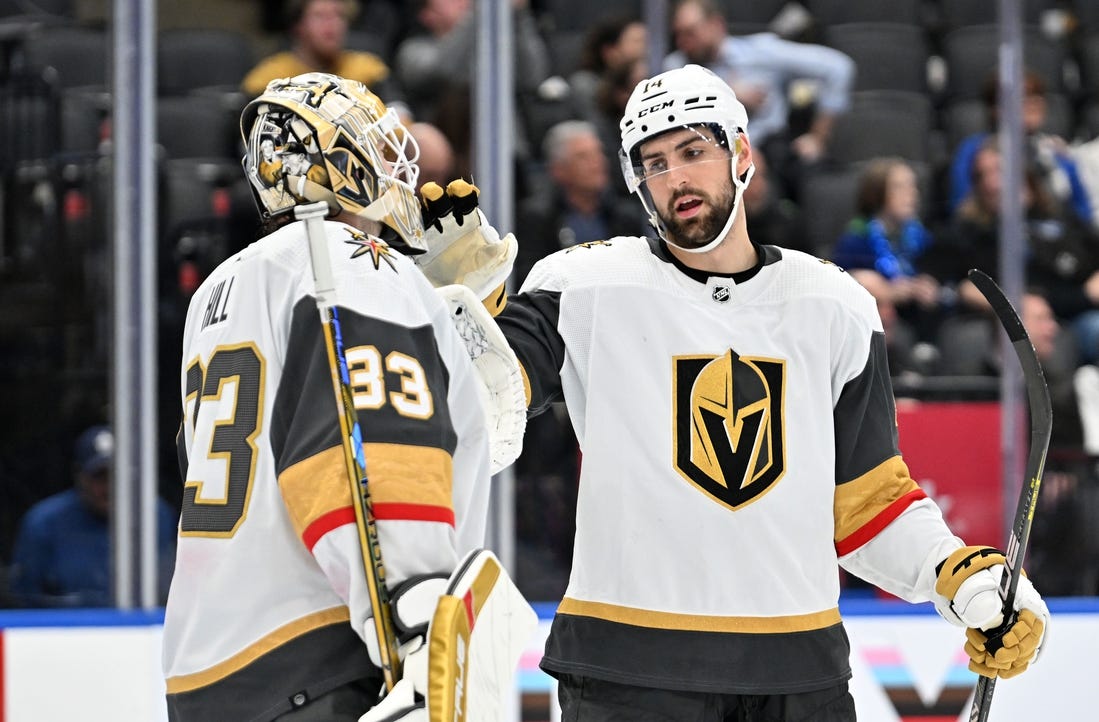 Feb 27, 2024; Toronto, Ontario, CAN;  Vegas Golden Knights defenseman Nicolas Hague (14)greets goalie Adin Hill (33) as they celebrate a win over the Toronto Maple Leafs at Scotiabank Arena. Mandatory Credit: Dan Hamilton-USA TODAY Sports