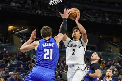 Feb 27, 2024; Orlando, Florida, USA; Brooklyn Nets forward Cameron Johnson (2) goes to the basket against Orlando Magic center Moritz Wagner (21) during the second half at Amway Center. Mandatory Credit: Mike Watters-USA TODAY Sports