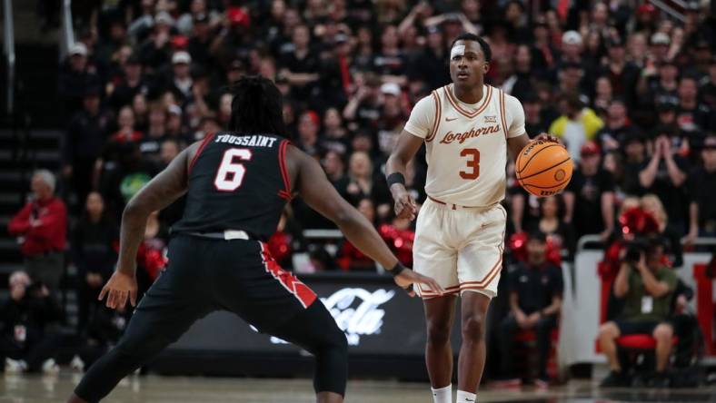 Feb 27, 2024; Lubbock, Texas, USA;  UT Longhorns guard Max Abmas (3) dribbles the ball against Texas Tech Red Raiders guard Joe Toussaint (6) in the first half at United Supermarkets Arena. Mandatory Credit: Michael C. Johnson-USA TODAY Sports