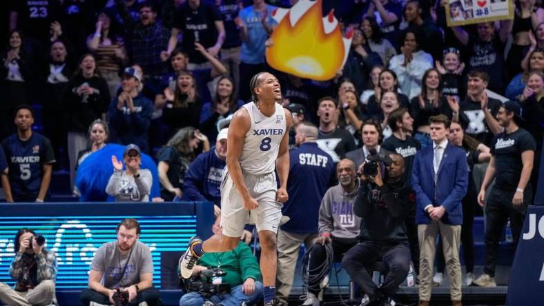 Xavier Musketeers guard Quincy Olivari (8) celebrates in the second half of the NCAA Big East conference basketball game between the Xavier Musketeers and the DePaul Blue Demons at the Cintas Center in Cincinnati on Wednesday, Feb. 28, 2024.