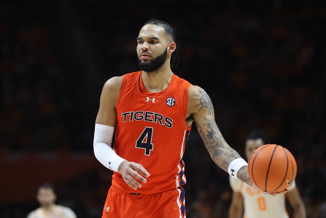 Feb 28, 2024; Knoxville, Tennessee, USA; Auburn Tigers forward Johni Broome (4) looks to move the ball against the Tennessee Volunteers during the second half at Thompson-Boling Arena at Food City Center. Mandatory Credit: Randy Sartin-USA TODAY Sports