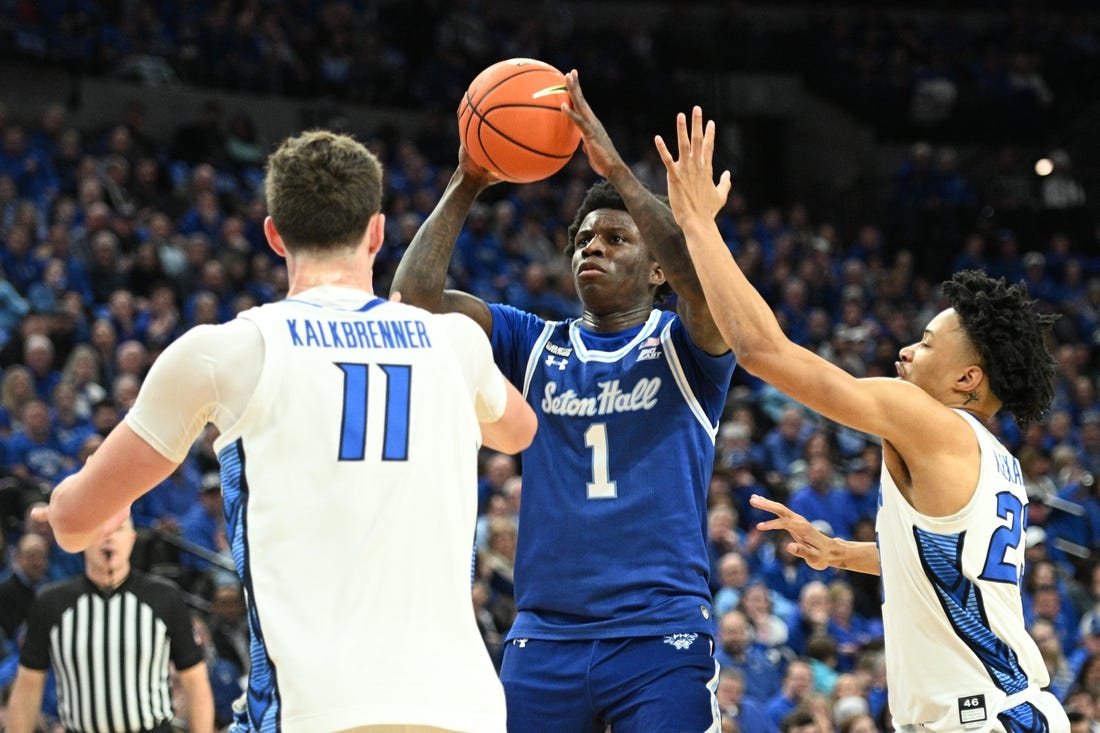 Feb 28, 2024; Omaha, Nebraska, USA; Seton Hall Pirates guard Kadary Richmond (1) shoots over Creighton Bluejays center Ryan Kalkbrenner (11) and guard Trey Alexander (23) in the first half at CHI Health Center Omaha. Mandatory Credit: Steven Branscombe-USA TODAY Sports