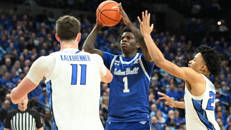 Feb 28, 2024; Omaha, Nebraska, USA; Seton Hall Pirates guard Kadary Richmond (1) shoots over Creighton Bluejays center Ryan Kalkbrenner (11) and guard Trey Alexander (23) in the first half at CHI Health Center Omaha. Mandatory Credit: Steven Branscombe-USA TODAY Sports