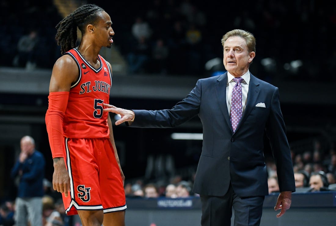 Feb 28, 2024; Indianapolis, Indiana, USA;  St. John's Red Storm guard Daniss Jenkins (5) talks with St. John's Red Storm head coach Rick Pitino during the second half at Hinkle Fieldhouse. Mandatory Credit: Robert Goddin-USA TODAY Sports
