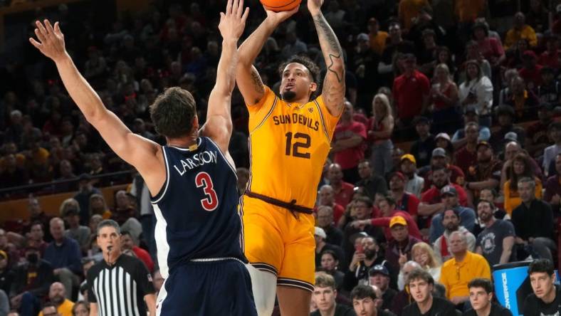 ASU Sun Devils guard Jose Perez (12) shoots the ball over UA Wildcats guard Pelle Larsson (3) at Desert Financial Arena in Tempe on Feb. 28, 2024.