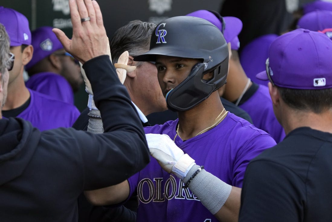 Feb 29, 2024; Mesa, Arizona, USA; Colorado Rockies shortstop Ezequiel Tovar (14) celebrates with teammates after hitting a solo home run against the Chicago Cubs in the third inning at Sloan Park. Mandatory Credit: Rick Scuteri-USA TODAY Sports