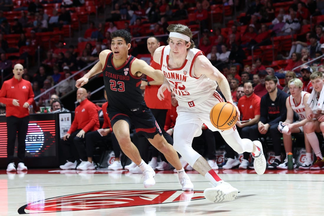 Feb 29, 2024; Salt Lake City, Utah, USA; Utah Utes center Branden Carlson (35) drives to the basket against Stanford Cardinal forward Brandon Angel (23) during the second half at Jon M. Huntsman Center. Mandatory Credit: Rob Gray-USA TODAY Sports