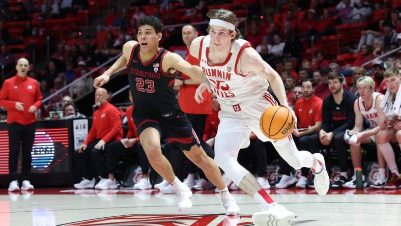 Feb 29, 2024; Salt Lake City, Utah, USA; Utah Utes center Branden Carlson (35) drives to the basket against Stanford Cardinal forward Brandon Angel (23) during the second half at Jon M. Huntsman Center. Mandatory Credit: Rob Gray-USA TODAY Sports