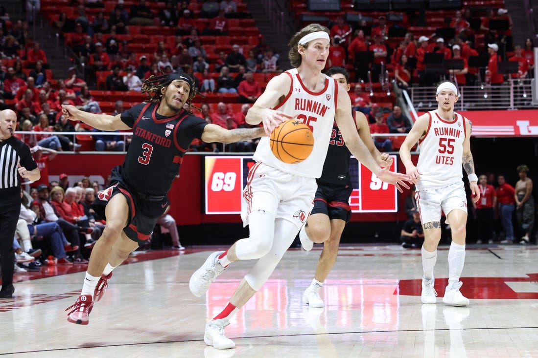 Feb 29, 2024; Salt Lake City, Utah, USA; Stanford Cardinal guard Kanaan Carlyle (3) knocks the ball away from Utah Utes center Branden Carlson (35) during the second half at Jon M. Huntsman Center. Mandatory Credit: Rob Gray-USA TODAY Sports