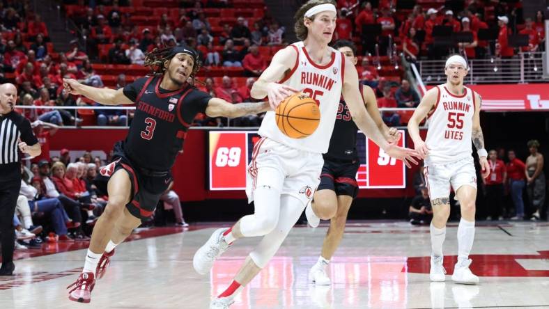 Feb 29, 2024; Salt Lake City, Utah, USA; Stanford Cardinal guard Kanaan Carlyle (3) knocks the ball away from Utah Utes center Branden Carlson (35) during the second half at Jon M. Huntsman Center. Mandatory Credit: Rob Gray-USA TODAY Sports