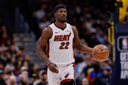 Feb 29, 2024; Denver, Colorado, USA; Miami Heat forward Jimmy Butler (22) dribbles the ball up court in the fourth quarter against the Denver Nuggets at Ball Arena. Mandatory Credit: Isaiah J. Downing-USA TODAY Sports