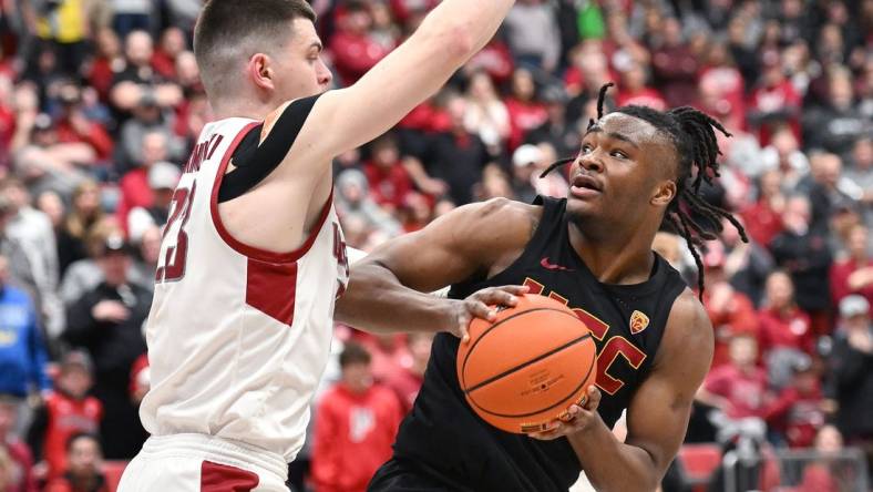 Feb 29, 2024; Pullman, Washington, USA; USC Trojans guard Isaiah Collier (1) shoots the ball againstWashington State Cougars forward Andrej Jakimovski (23) in the second half at Friel Court at Beasley Coliseum. Washington State Cougars won 75-72. Mandatory Credit: James Snook-USA TODAY Sports