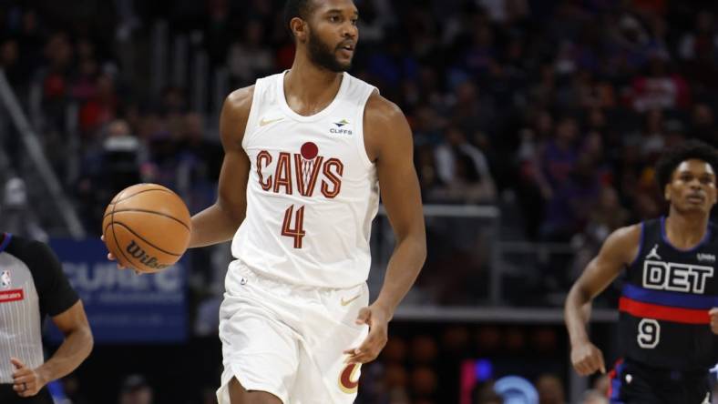 Mar 1, 2024; Detroit, Michigan, USA;  Cleveland Cavaliers forward Evan Mobley (4) dribbles in the first half against the Detroit Pistons at Little Caesars Arena. Mandatory Credit: Rick Osentoski-USA TODAY Sports