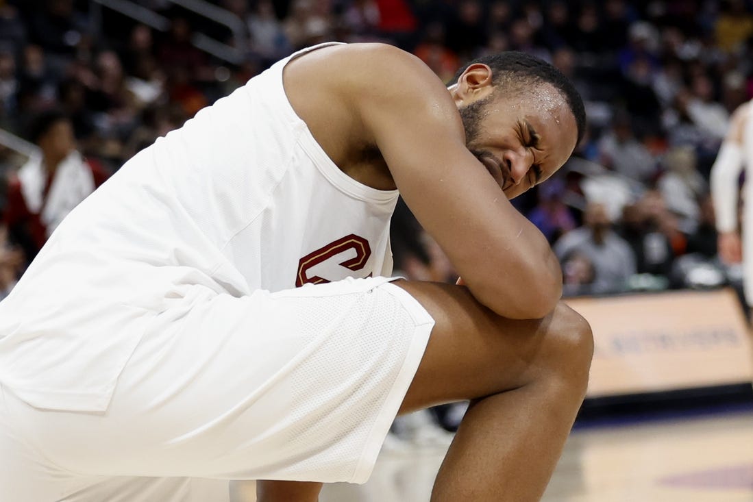 Mar 1, 2024; Detroit, Michigan, USA;  Cleveland Cavaliers forward Evan Mobley (4) reacts after he is poked in the eye in the first half against the Detroit Pistons at Little Caesars Arena. Mandatory Credit: Rick Osentoski-USA TODAY Sports