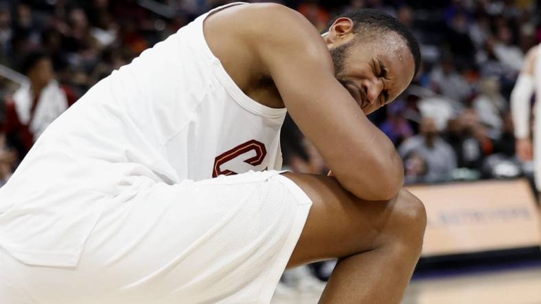 Mar 1, 2024; Detroit, Michigan, USA;  Cleveland Cavaliers forward Evan Mobley (4) reacts after he is poked in the eye in the first half against the Detroit Pistons at Little Caesars Arena. Mandatory Credit: Rick Osentoski-USA TODAY Sports