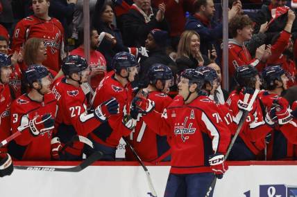 Mar 1, 2024; Washington, District of Columbia, USA; Washington Capitals defenseman John Carlson (74) celebrates with teammates after scoring a goal against the Philadelphia Flyers in the second period at Capital One Arena. Mandatory Credit: Geoff Burke-USA TODAY Sports