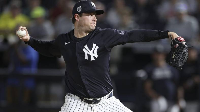 Mar 1, 2024; Tampa, Florida, USA;  New York Yankees starting pitcher Gerrit Cole (45) throws a pitch against the Toronto Blue Jays in the first inning at George M. Steinbrenner Field. Mandatory Credit: Nathan Ray Seebeck-USA TODAY Sports