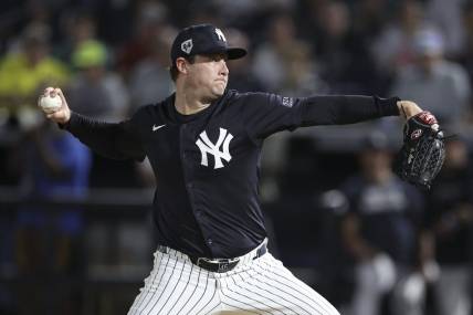 Mar 1, 2024; Tampa, Florida, USA;  New York Yankees starting pitcher Gerrit Cole (45) throws a pitch against the Toronto Blue Jays in the first inning at George M. Steinbrenner Field. Mandatory Credit: Nathan Ray Seebeck-USA TODAY Sports