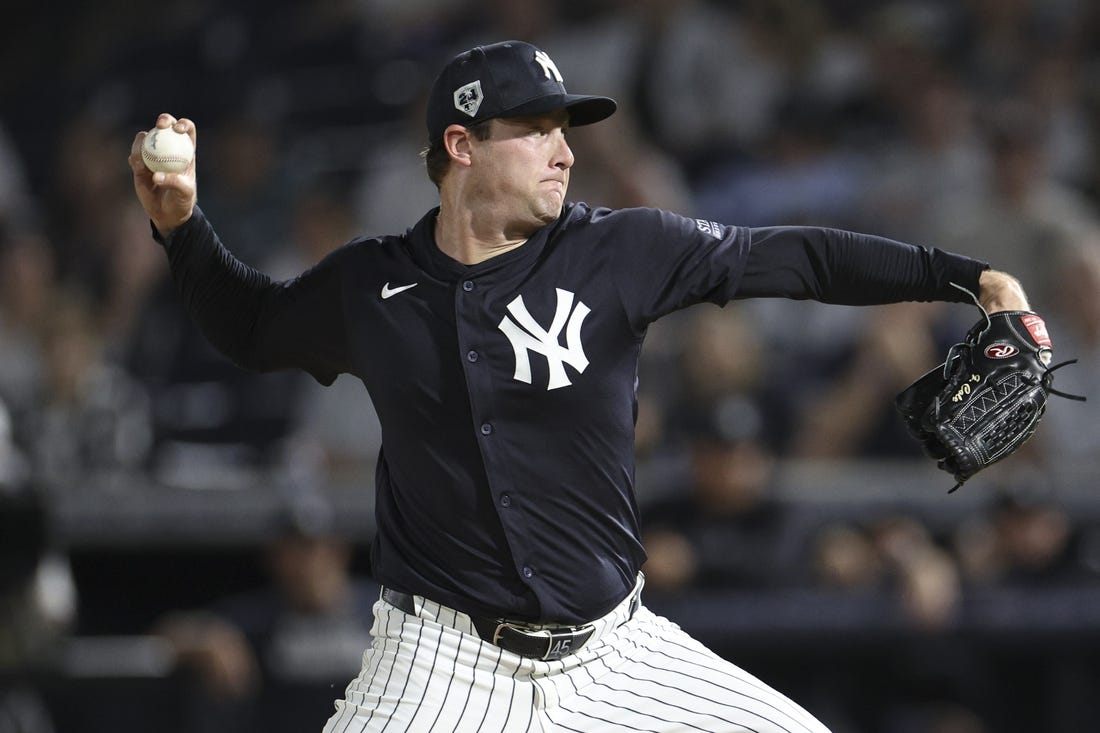 Mar 1, 2024; Tampa, Florida, USA;  New York Yankees starting pitcher Gerrit Cole (45) throws a pitch against the Toronto Blue Jays in the first inning at George M. Steinbrenner Field. Mandatory Credit: Nathan Ray Seebeck-USA TODAY Sports