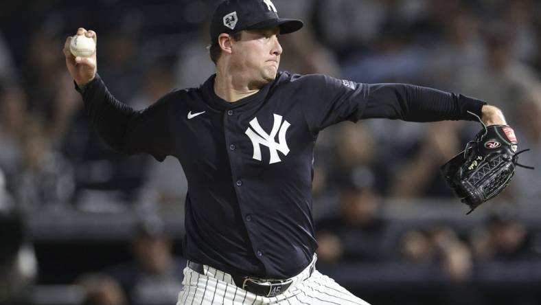 Mar 1, 2024; Tampa, Florida, USA;  New York Yankees starting pitcher Gerrit Cole (45) throws a pitch against the Toronto Blue Jays in the first inning at George M. Steinbrenner Field. Mandatory Credit: Nathan Ray Seebeck-USA TODAY Sports